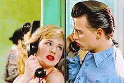 Man And Woman Talking On Telephone GIF