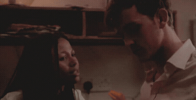 Man And Woman Talking Woman Holding Paper GIF