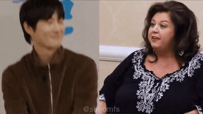 Man And Woman Talking, Woman In Black-And-White Dress GIF