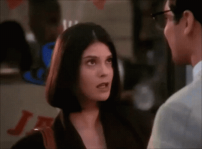 Man And Woman Talking Woman Wearing Glasses GIF
