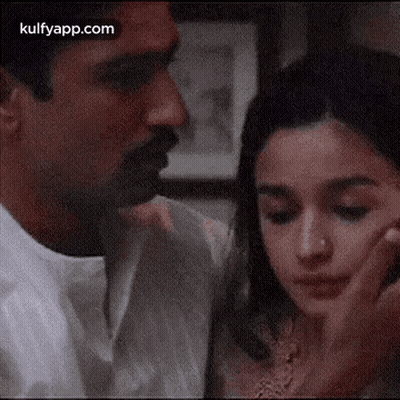 Man And Woman Touching Faces GIF