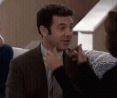 Man And Woman Touching Wrists Saying I Love You In Pink GIF