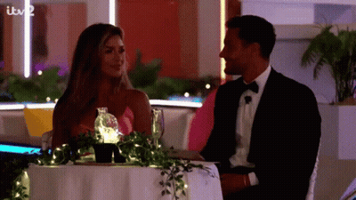 Man And Woman Walking Down Sidewalk GIF