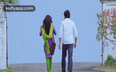 Man And Woman Walking Down Street Kulfyapp.com GIF