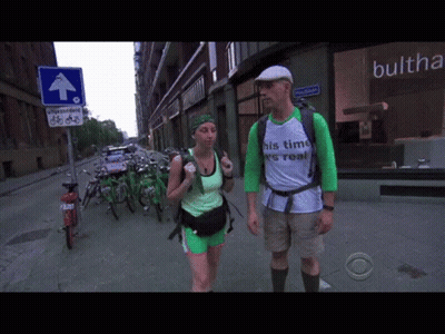 Man And Woman Walking Down Street Shirt Says His Time Is Real GIF
