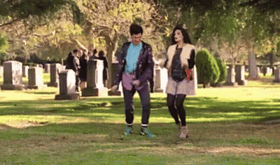 Man And Woman Walking In Cemetery GIF