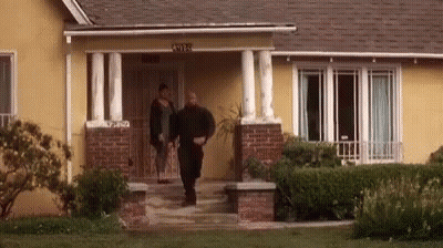 Man And Woman Walking Into House GIF