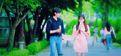 Man And Woman Walking On Sidewalk GIF