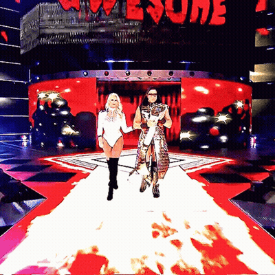 Man And Woman Walking On Stage In Front Of Home Sign GIF