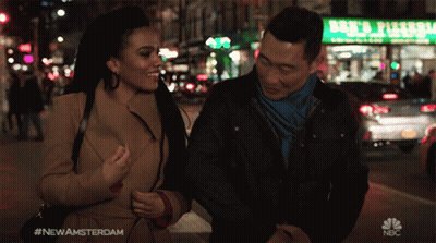 Man And Woman Walking Past Ben's Pizzeria GIF