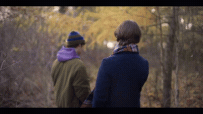 Man And Woman Walking Through Forest Holding Hands GIF