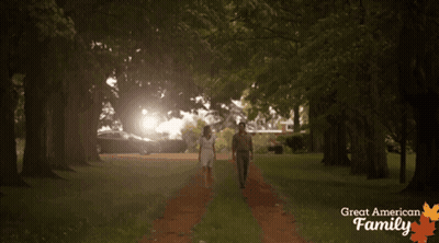 Man And Woman Walking With Great American Family GIF