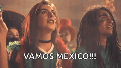 Man And Woman Watching Soccer Saying Vamos Mexico GIF