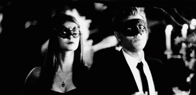 Man And Woman Wearing Masks At Party GIF