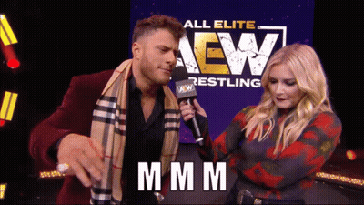 Man And Woman With All Elite AEW Sign GIF