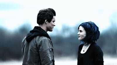 Man And Woman With Blue Hair Looking At Each Other GIF