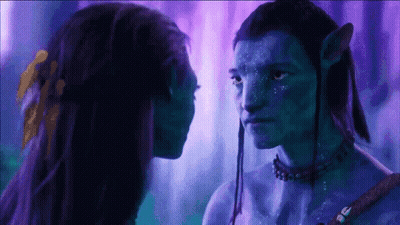 Man And Woman With Blue Painted Faces Looking At Each Other GIF