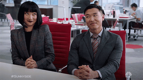 Man And Woman With Folded Hands At Office Table GIF