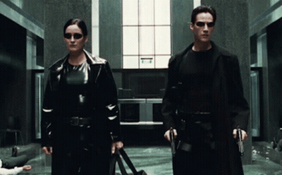 Man And Woman With Guns GIF