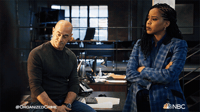 Man And Woman With Hashtag Organized Crime GIF