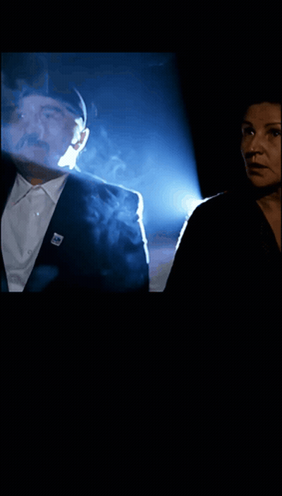 Man And Woman With Smoke Coming Out Of Eyes GIF