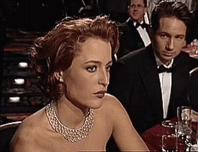 Man And Woman With Wine Glasses At Table GIF