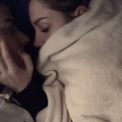 Man And Woman Wrapped In White Blanket GIF