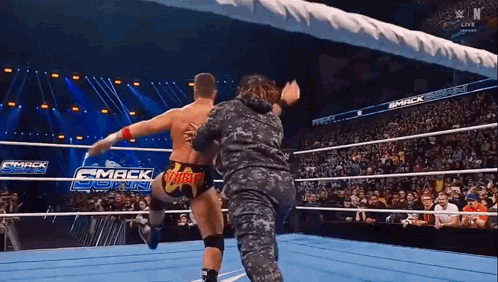 Man And Woman Wrestling In Ring GIF