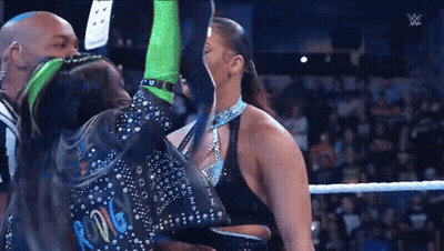 Man And Woman Wrestling, Woman In Green Gloves GIF