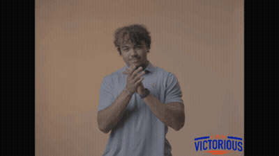 Man Applauding In Front Of Victorious Sign GIF