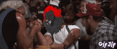 Man Arm Wrestling Another Man In Lion Mask GIF