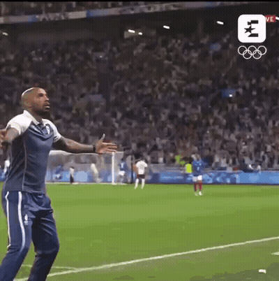 Man Arms Outstretched In Front Of Crowd On Soccer Field GIF