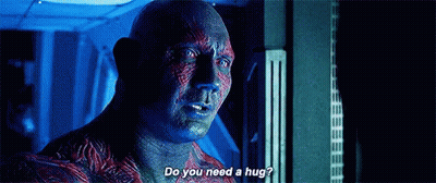 Man Asking Another If He Needs A Hug GIF