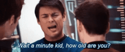 Man Asking Two Others To Wait A Minute GIF