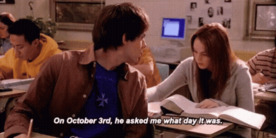 Man Asking Woman What Day It Was At Desk GIF