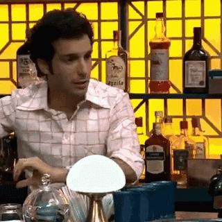 Man At Bar With Agada Bottle GIF