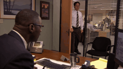 Man At Desk In Front Of Hawaii Sign GIF
