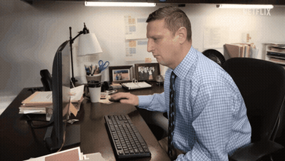 Man At Desk In Front Of Netflix Computer GIF