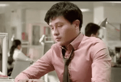 Man At Desk In Pink Shirt And Tie GIF