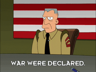 Man At Desk Saying War Were Declared GIF