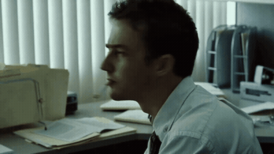 Man At Desk With Attorney Folder By Window GIF