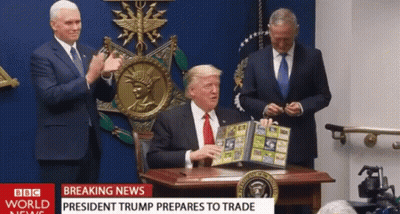 Man At Desk With BBC World News Headline GIF