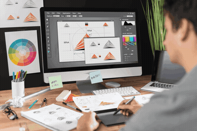 Man At Desk With Computer And Brand Sticky Note GIF