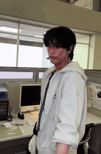 Man At Desk With Computer And E Sign GIF
