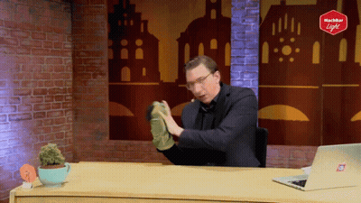 Man At Desk With Laptop And Richter Light Sign GIF