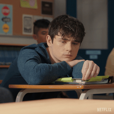 Man At Desk With Netflix Logo GIF