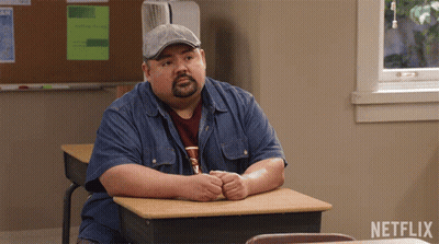 Man At Desk With Netflix Logo GIF
