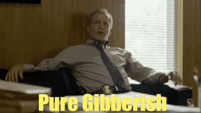 Man At Desk With Pure Gibberish Sign GIF