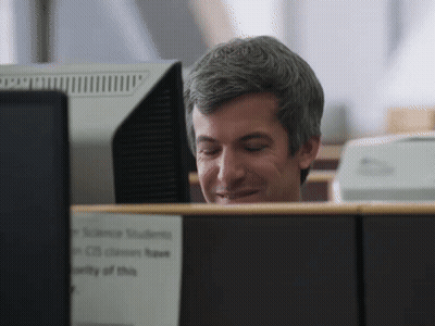 Man At Desk With Science Students Sign GIF