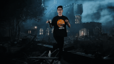 Man At Haunted House With Pumpkin Shirt GIF